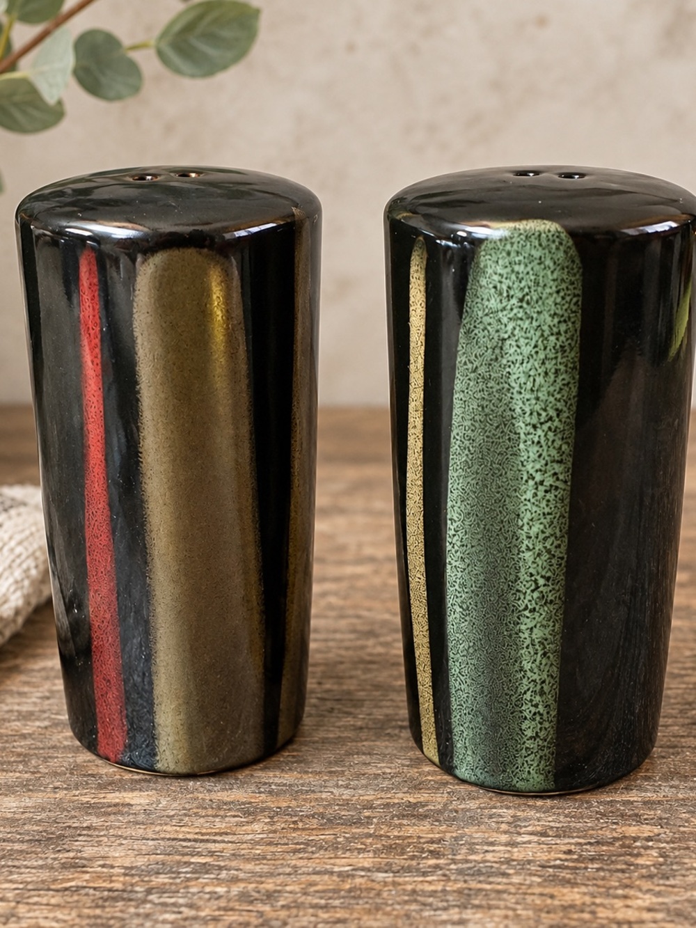 Sango Black Ceramic Salt and Pepper Shakers with Green, Red & Gold Accents